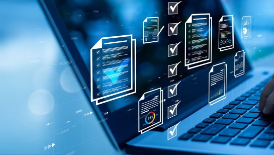 Person typing on a laptop with digital document and checklist icons, representing managed network security services in Central Ontario