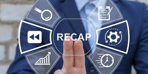 Businessperson touching a virtual interface with icons and the word ‘Recap’ displayed at the center.