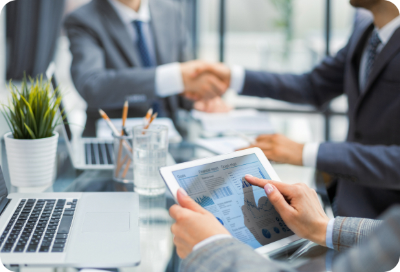 A group of businessmen working on ipads