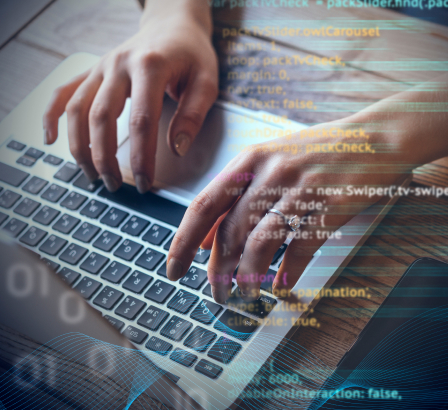 Code overlayed overtop of a woman typing