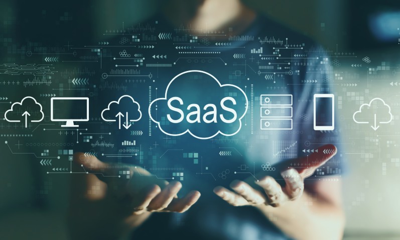 Hands presenting a cloud interface labeled ‘SaaS’ with icons representing software, servers, and cloud computing services