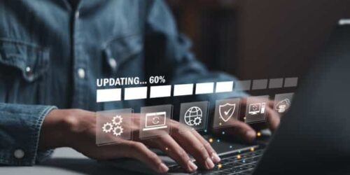 Businessman working and installing update process. Software updates or operating system upgrades to keep your device up to date with enhanced functionality in new versions and improved security.