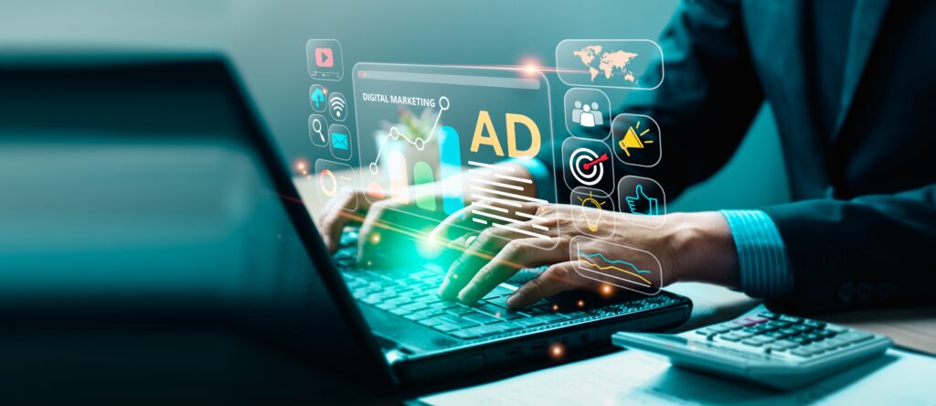 A panoramic, wide-angle shot of a person typing on a laptop, surrounded by glowing neon holographic icons representing digital marketing and business analytics. A central digital window displays a bar chart, a line graph, and the bold text 
