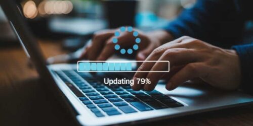 Vibrant photo of Software update process on laptop computer with progress bar and loading icon