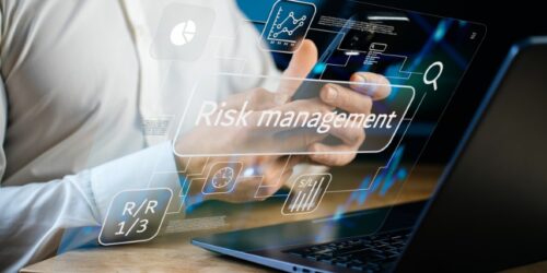Risk management and strategic decision-making concept, digital interface with analytics, performance indicators, forecasts, risk reward and stop loss tools, man analyzing charts