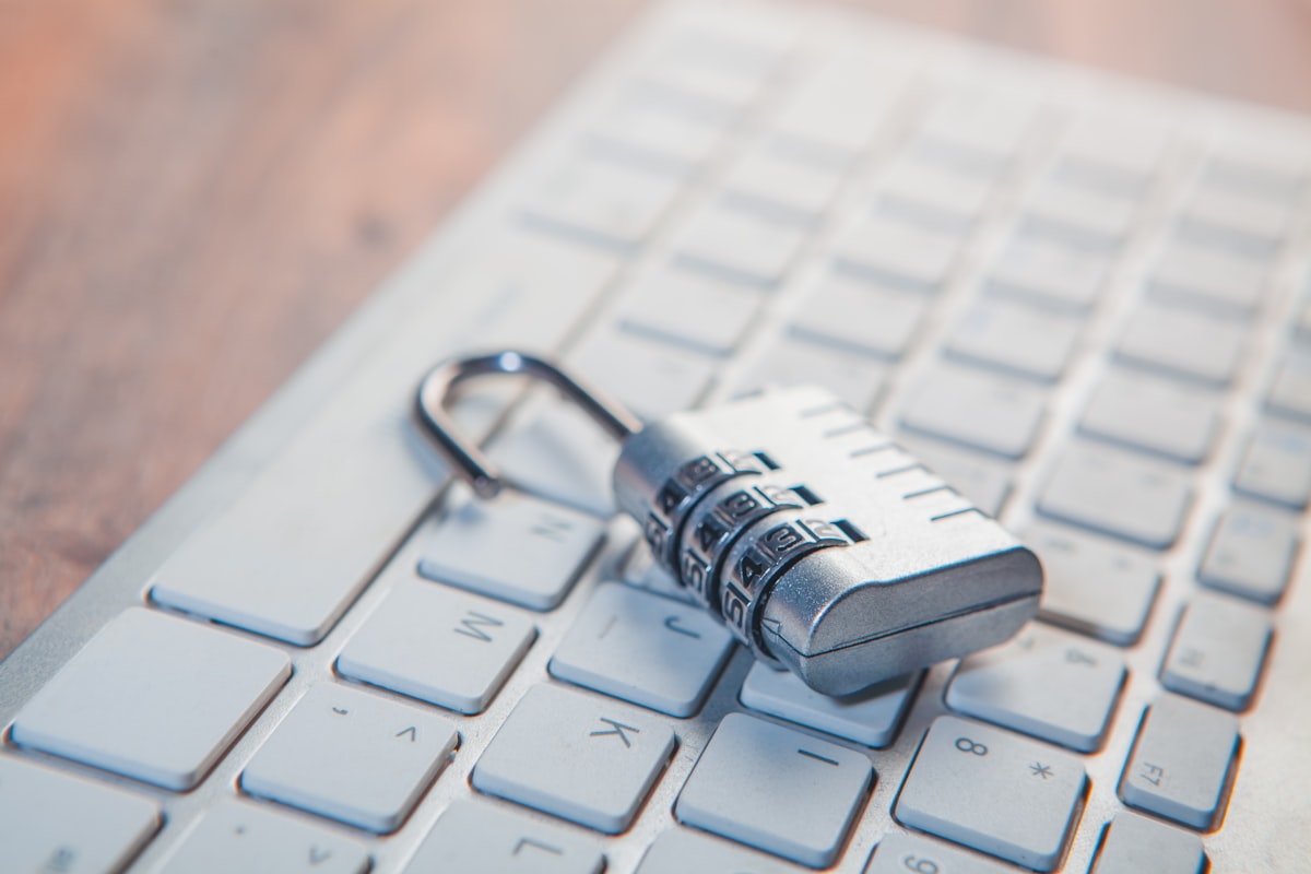 Padlock on a laptop keyboard representing ransomware and endpoint protection