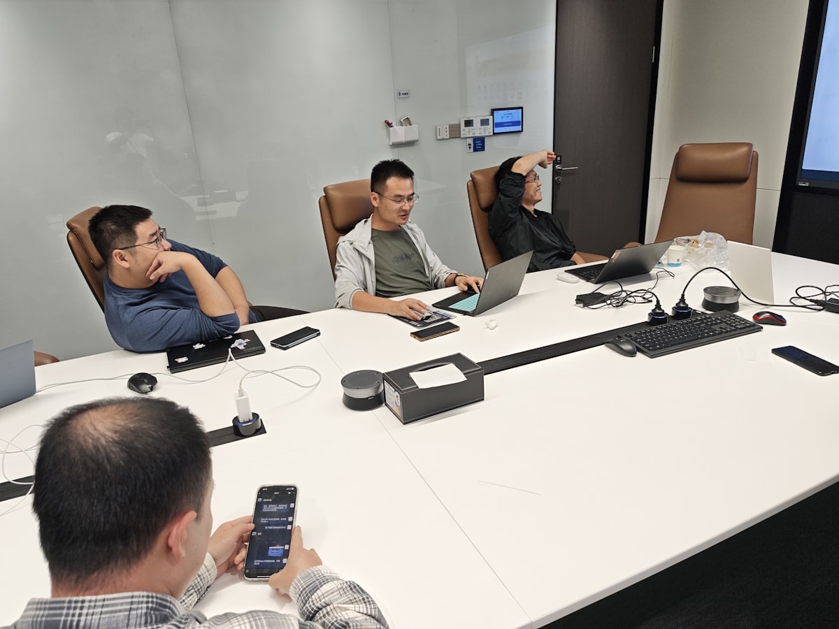 Quarterly business review meeting with laptops