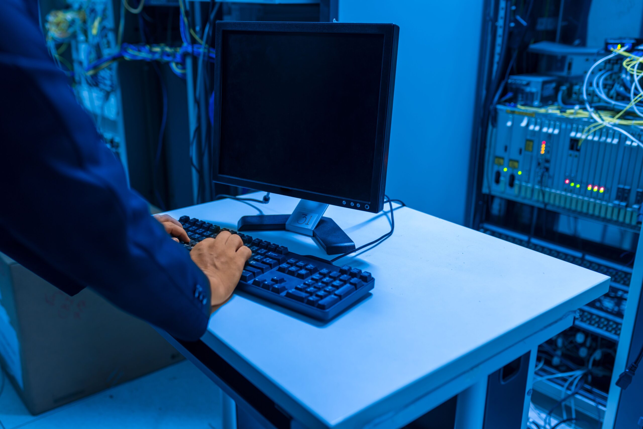 IT support professional working in a server room
