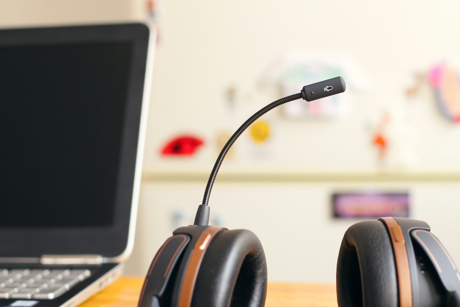 Headset beside a laptop, representing a named IT support contact rather than a rotating helpdesk queue