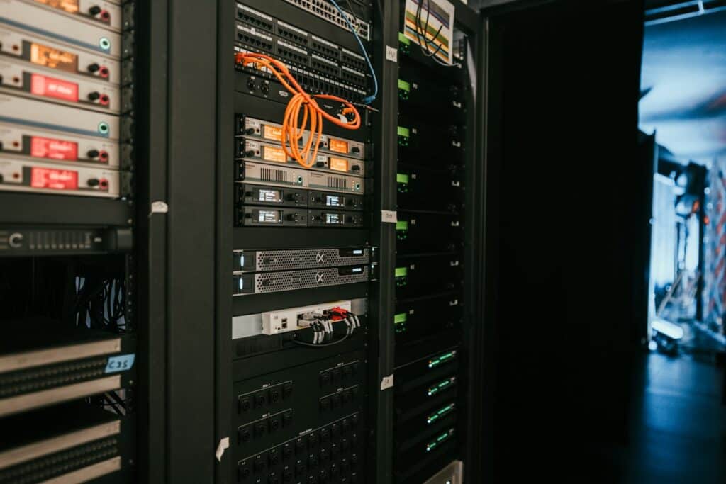 Server rack in a server room, representing systems covered by remote IT monitoring