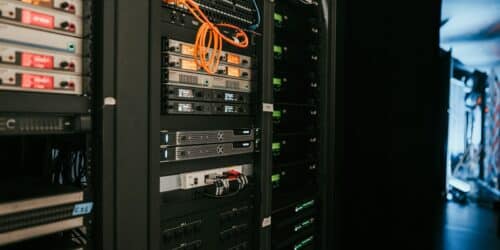 Server rack in a server room, representing systems covered by remote IT monitoring