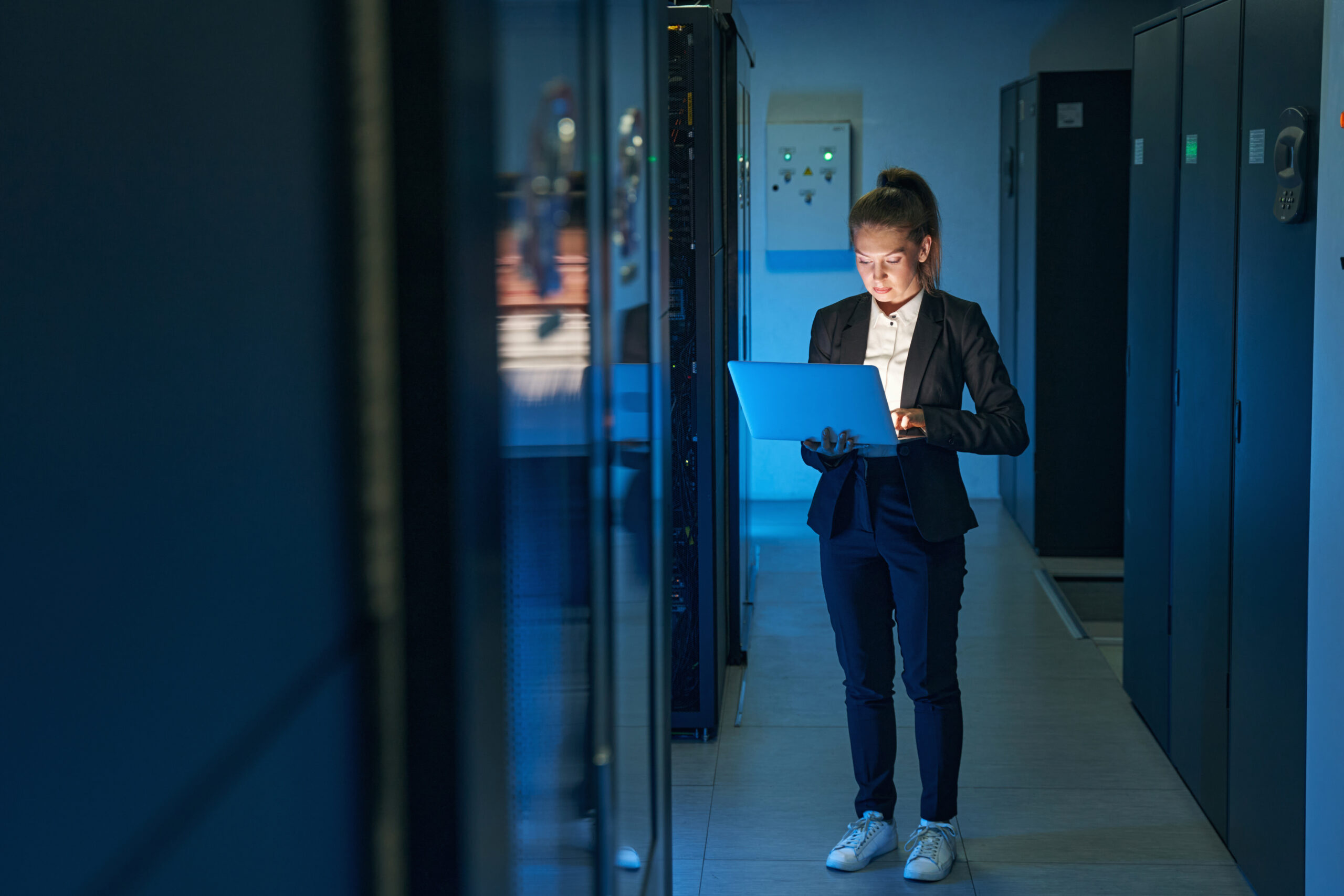 Technician assessing servers before cloud migration
