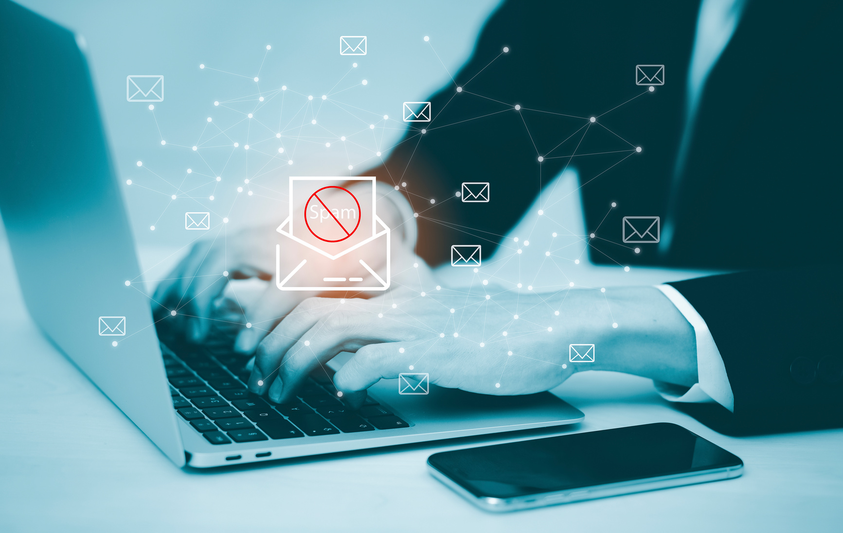 Employee at a laptop reviewing an email flagged as suspicious, the kind of message a phishing simulation uses to test staff