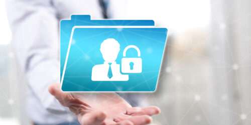 A businessperson holding out a hand with a floating icon of a personal profile inside a folder secured with a padlock, representing the concept of personal data security under PIPEDA