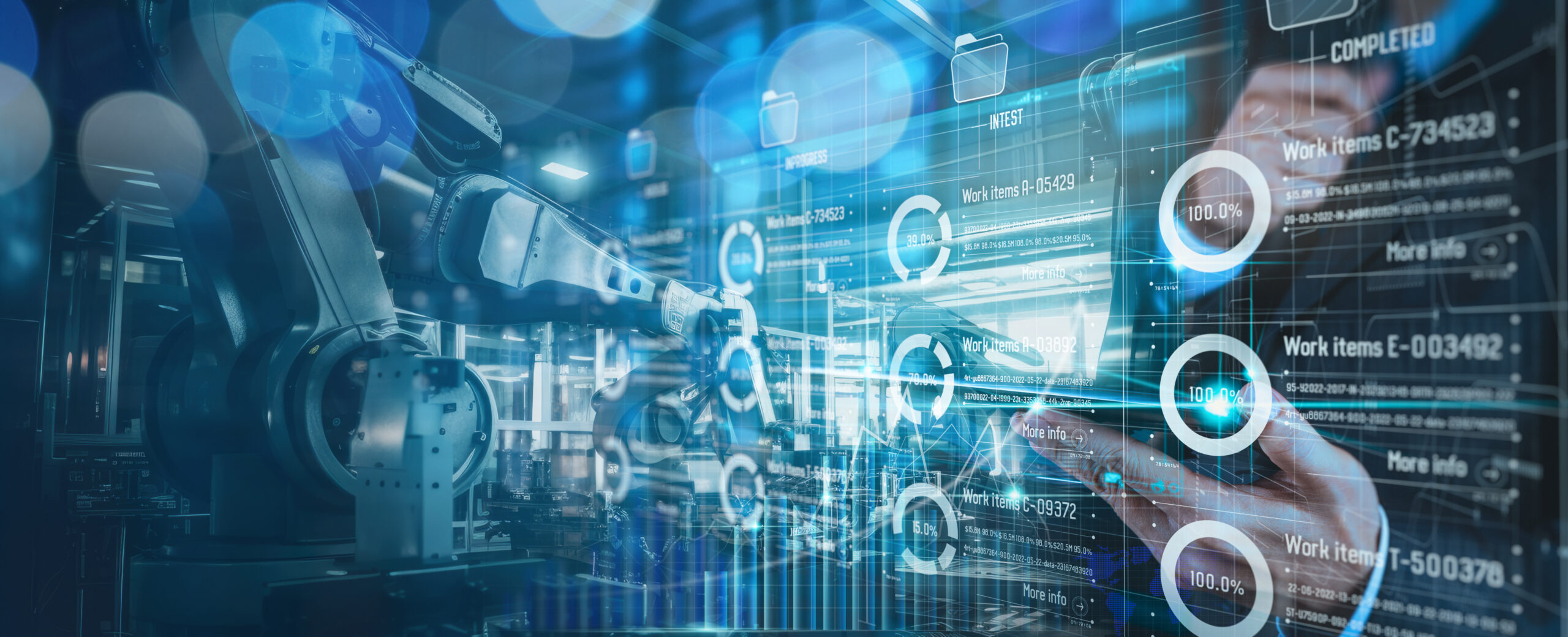 An engineer monitoring automation and robotics on a digital interface in a manufacturing facility, representing the industrial systems targeted by ransomware