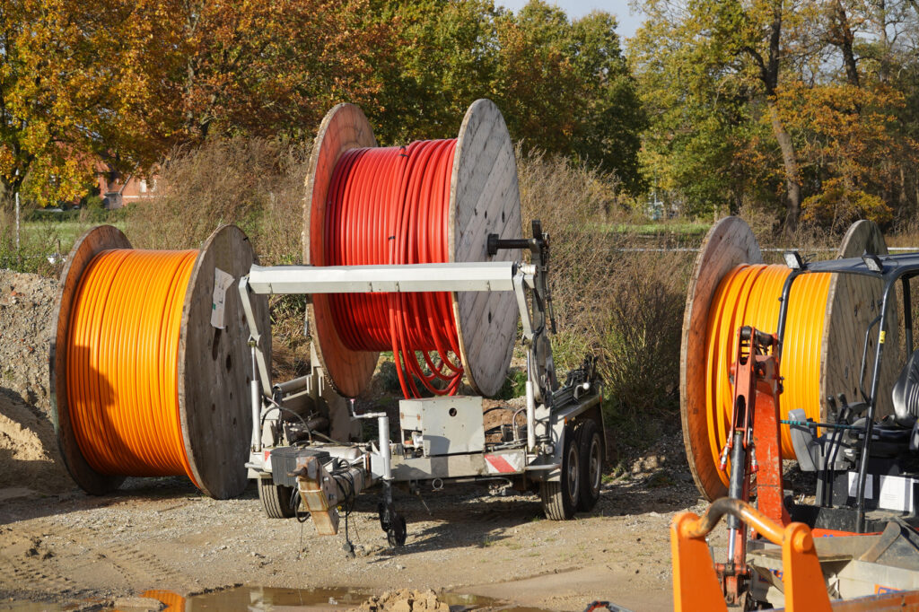 Reels of new fibre optic cable ready to bring high-speed internet to rural businesses, the groundwork for a cloud migration