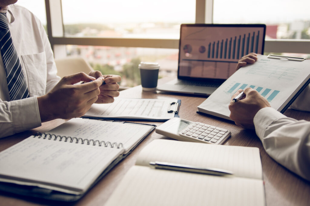 Partners at a professional services firm reviewing quarterly figures together, as a Markham firm would when budgeting for managed IT