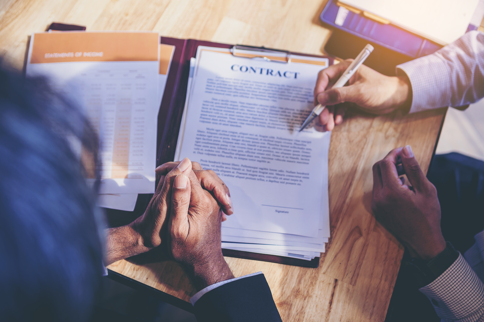 Business owner reading the termination terms of a managed IT agreement before signing
